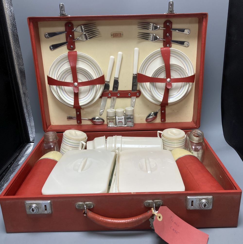 A 1960s Sirram picnic hamper set, in red vinyl case